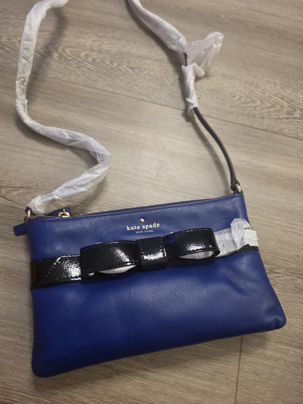kate spade cobalt blue leather crossbody with black patent bow